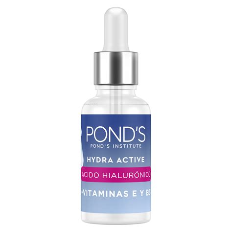 Botella de serum y crema con ácido hialurónico junto a una mascarilla facial