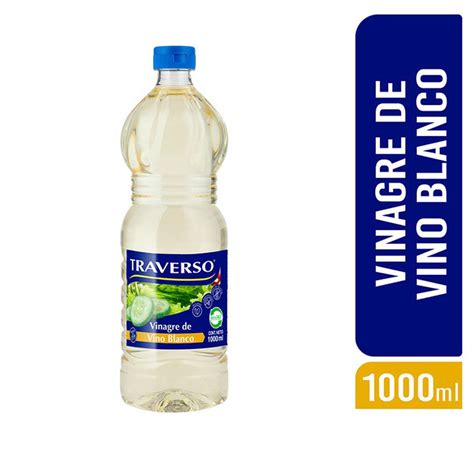 Botella de vinagre blanco y limones